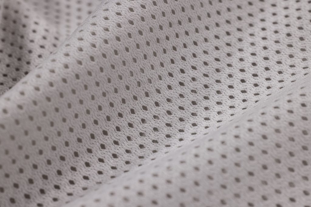 Gros plan texture polyester maille blanche tissée
