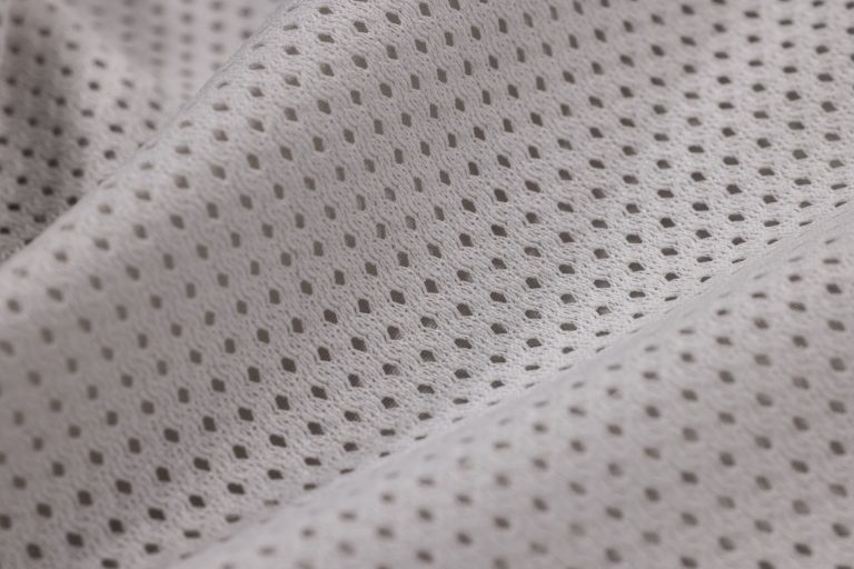 Gros plan texture polyester maille blanche tissée