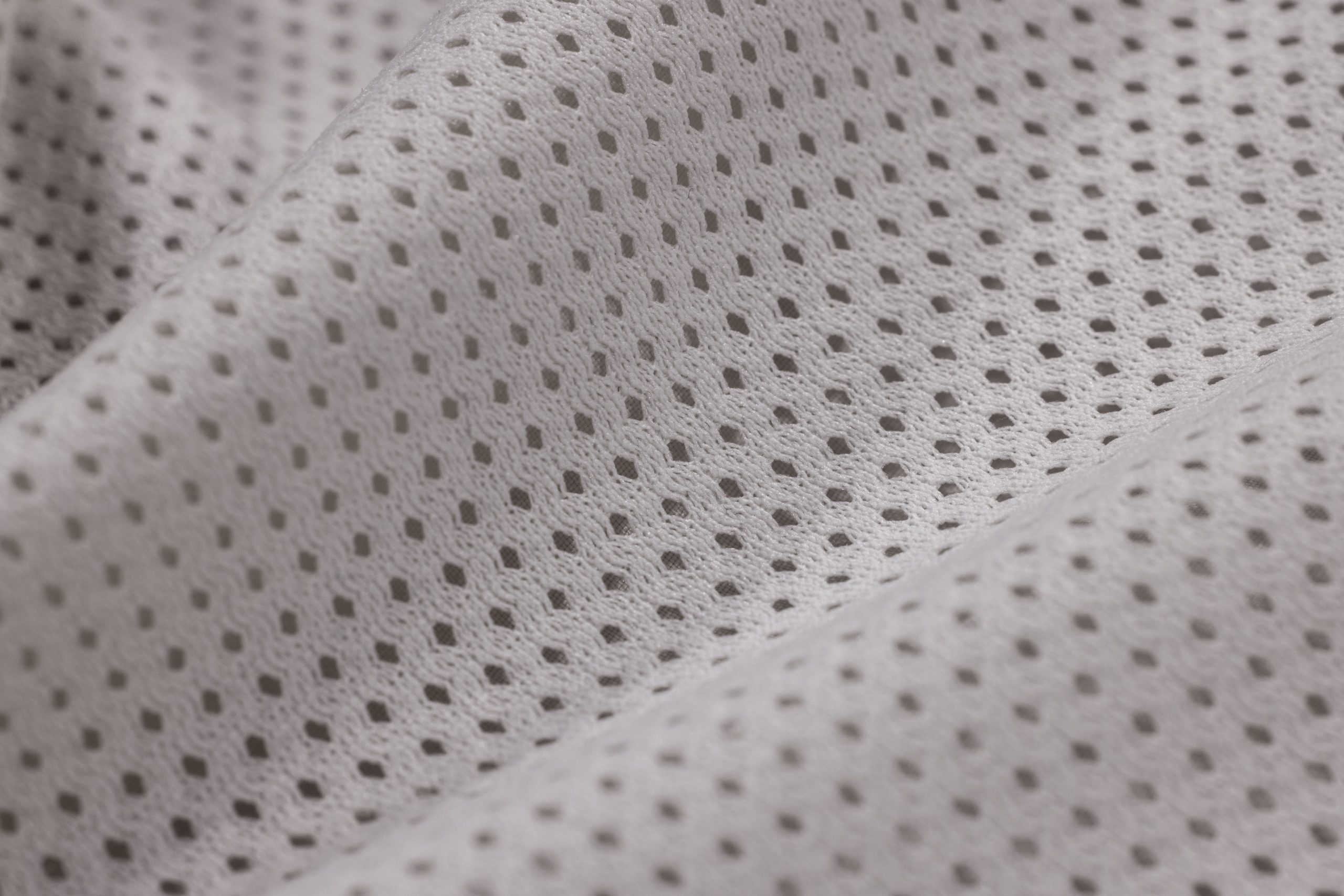 Gros plan texture polyester maille blanche tissée