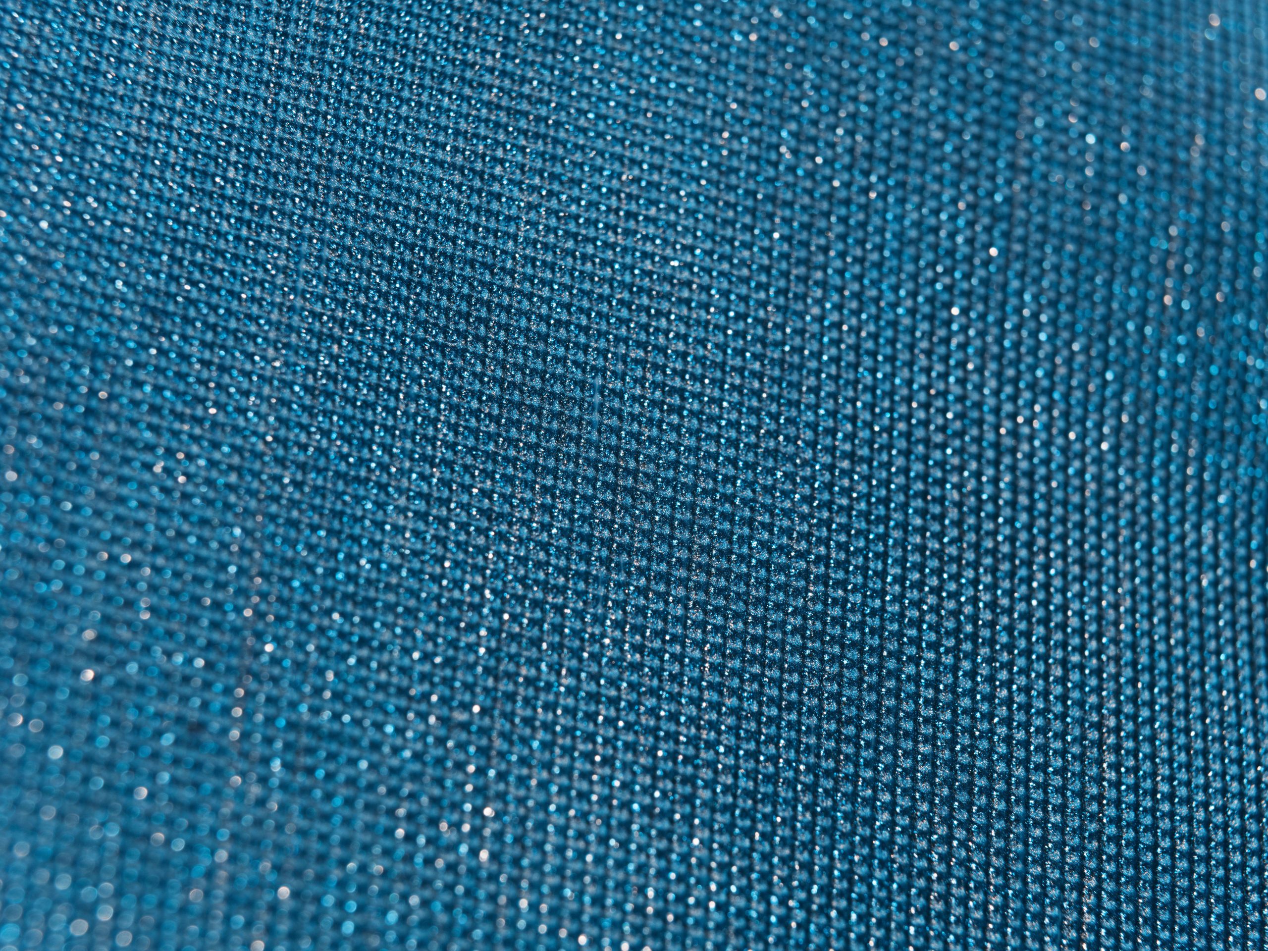 Tissu bleu texturé scintillant gros plan